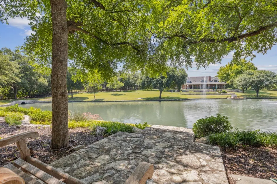 Pond and stone patio at a Parker property